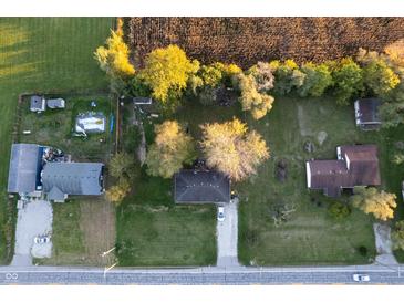 Aerial view of multiple houses and properties with surrounding land at 3837 W State Road 32 W W, Westfield, IN 46074