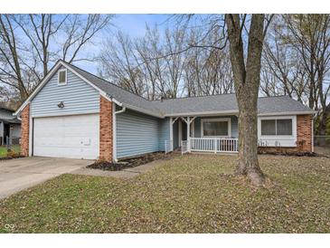 Ranch home with attached garage and front porch at 5346 Shefford Ct, Indianapolis, IN 46254