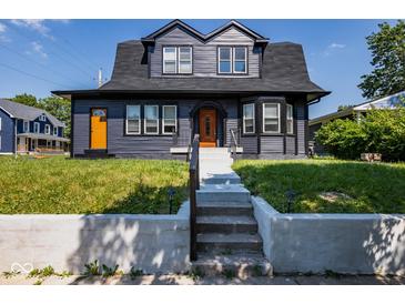 Charming two-story home with dark exterior and lawn at 2641 Guilford Ave, Indianapolis, IN 46205