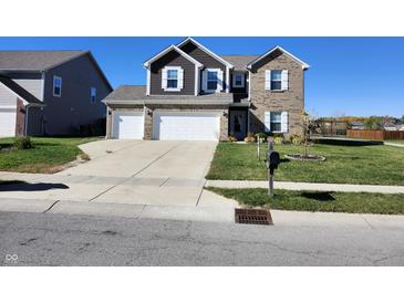 Two-story house with three-car garage and landscaping at 428 N Wyndstone Way, Fortville, IN 46040