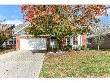 Brick ranch home with attached garage and landscaping at 3518 Heathcliff Ct, Westfield, IN 46074