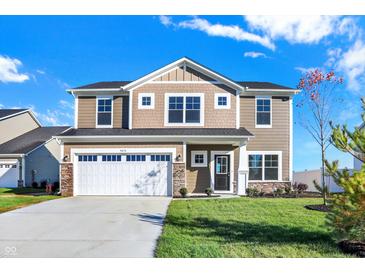 Two story house with a two-car garage and nice landscaping at 5870 Fair Oak Cir, Brownsburg, IN 46112