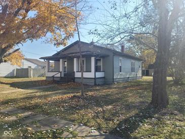 Charming single story home with front porch and landscaped yard at 325 E Church St, Paragon, IN 46166