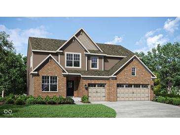 Two-story home with brick and siding exterior, two-car garage, and landscaping at 3628 Planck Cir, Danville, IN 46122