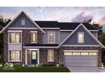 Two-story home with brick and siding exterior, featuring a two-car garage at 1105 Gatewick Ct, Greenwood, IN 46143