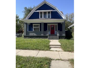 Charming blue house with gray accents and a red door at 350 S Grand Ave, Indianapolis, IN 46219