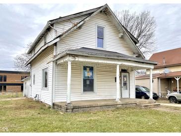 Two story home with front porch and street view at 310 S Pleasant St, Edinburgh, IN 46124