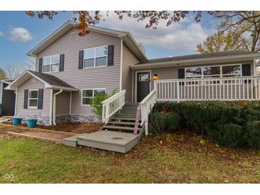 Two-story house with gray siding, white trim, and a deck at 2355 W State Road 234, Fortville, IN 46040