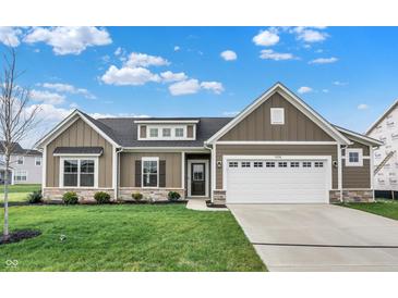 New construction home features a charming exterior with stone accents and a two-car garage at 7098 Sterling Way, Brownsburg, IN 46112