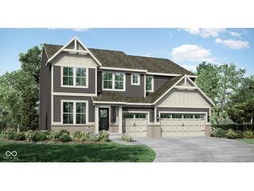Two-story home with gray siding, stone accents, and a three-car garage at 1836 Vista Ridge Dr, Greenwood, IN 46143