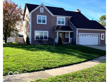 Two-story house with a spacious lawn and attached two-car garage at 636 Creston Point Cir, Indianapolis, IN 46239