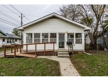 White house with porch, ramp, and small yard at 1708 S Randolph St, Indianapolis, IN 46203