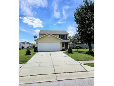 Two-story house with attached garage and a well-maintained lawn at 5236 Bluff View Dr, Indianapolis, IN 46217