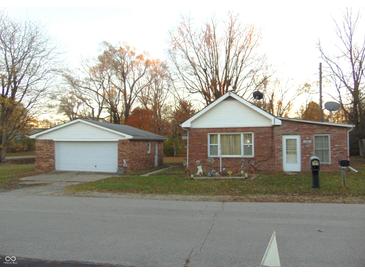 Brick ranch home with attached garage and spacious yard at 137 E Vine St, Jamestown, IN 46147