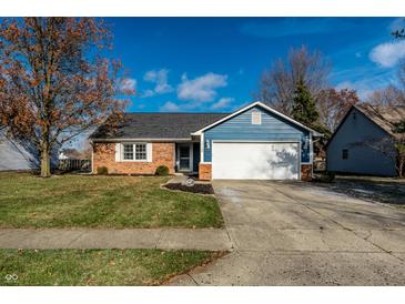 Brick and blue-sided Ranch home with a 1-car garage and well-manicured lawn at 12128 Rossi Dr, Indianapolis, IN 46236