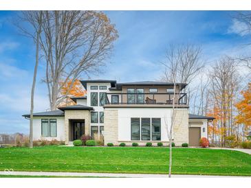 Stunning two-story home with modern design, stone accents, and a spacious lawn at 3809 Cherwell Drive, Zionsville, IN 46077