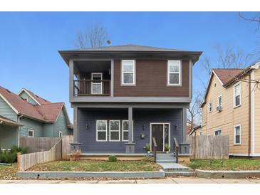 Two-story modern home with gray siding, brown accents, and a front porch at 1037 Jefferson Ave, Indianapolis, IN 46201