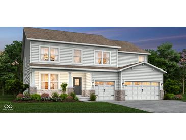 Two-story house with a neutral color palette, two-car garage, and landscaped lawn at 4342 Chital Pl, Greenwood, IN 46143