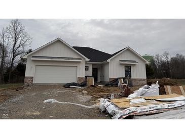 Two-story craftsman home with white siding, dark roof, and attached garage at 5143 Oak Rdg Pl, Columbus, IN 47201