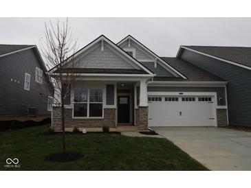 Charming two-story home with gray siding, white trim, and a covered entryway at 16946 Cattle Hollow Ln, Noblesville, IN 46060