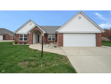 Brick ranch home with attached garage and landscaped yard at 4126 S Black Oak Ln, New Palestine, IN 46163