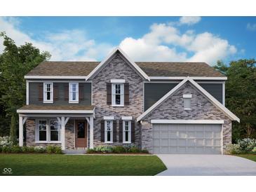 Two-story brick home with gray accents, shutters, and a two-car garage at 12023 Crestwater Ct, Fishers, IN 46037