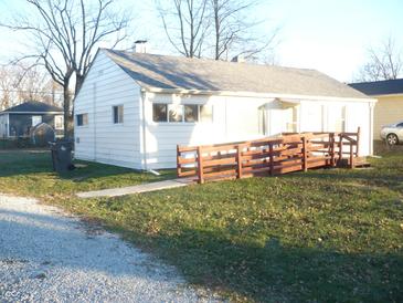 White ranch house with accessible ramp and yard at 4023 N Elizabeth N St, Indianapolis, IN 46226