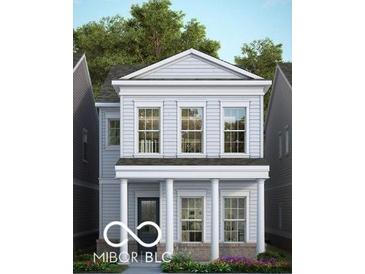 Two-story home with gray siding, white columns, and brick base at 537 Gilder Dr, Carmel, IN 46032