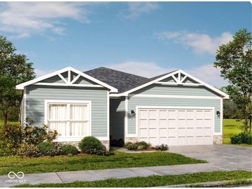 Charming single-story home with a two-car garage and landscaped front yard at 9913 Waterside Dr, Noblesville, IN 46064