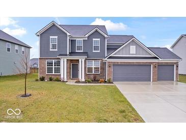 Charming two-story home with a three-car garage and landscaped yard at 5655 Lighthouse Dr, Brownsburg, IN 46112