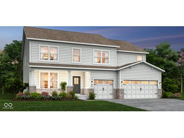 Two-story house with light gray siding, brick accents, and a two-car garage at 1867 Vista Ridge Dr, Greenwood, IN 46143