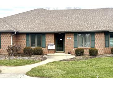 Brick ranch home with well-manicured lawn and walkway at 316 Northpointe Ct, Danville, IN 46122