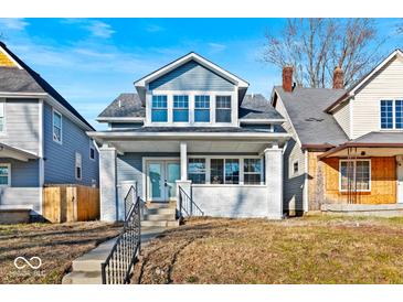 Newly renovated craftsman home with gray siding and a welcoming front porch at 950 W 33Rd St, Indianapolis, IN 46208