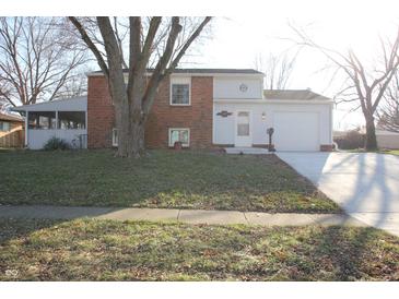 Brick ranch home with attached garage and screened porch at 207 Maplebrook Dr, Brownsburg, IN 46112