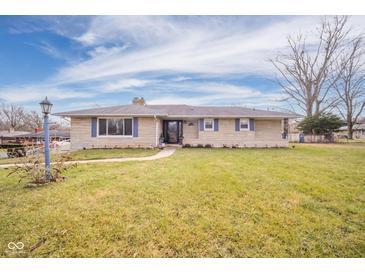 Ranch home with stone exterior, landscaped lawn, and walkway at 2221 E 35Th St, Anderson, IN 46013