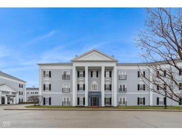 Gray building with white columns and black shutters at 12914 University Cres # 3C, Carmel, IN 46032