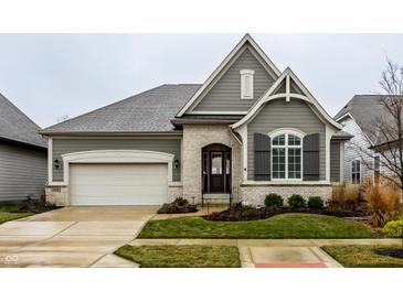 Gray siding two-story house with a white door and attached garage at 1915 Granville Dr, Westfield, IN 46074