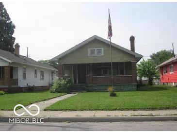 Charming bungalow with brick facade and a spacious lawn at 3953 English Ave, Indianapolis, IN 46201