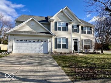 Two-story house with a large front yard, driveway, and attached garage at 2181 Russet Ct, Plainfield, IN 46168