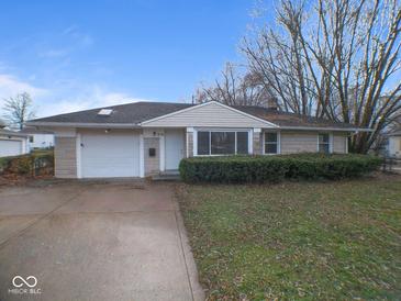 House exterior featuring a ranch style home with a well-maintained lawn at 515 Churchman Ave, Beech Grove, IN 46107