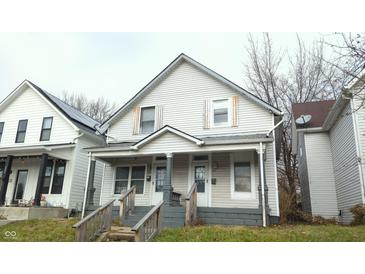 Two-unit building, light gray siding, front porches, and steps at 604 Lincoln St, Indianapolis, IN 46203