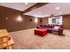 Finished basement with home theater and seating at 2569 Dawn Ridge Dr, Carmel, IN 46074