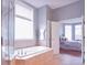 Bathroom with a large soaking tub and access to bedroom at 2569 Dawn Ridge Dr, Carmel, IN 46074
