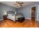 Bright bedroom with hardwood floors and ceiling fan at 2569 Dawn Ridge Dr, Carmel, IN 46074