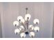 Close-up of a stunning, multi-light chandelier at 2569 Dawn Ridge Dr, Carmel, IN 46074