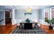 Spacious dining room, hardwood floors, and an updated chandelier at 2569 Dawn Ridge Dr, Carmel, IN 46074
