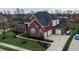 Brick house with a three-car garage and nicely landscaped yard at 2569 Dawn Ridge Dr, Carmel, IN 46074