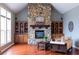 Cozy Gathering room with a stone fireplace and built-in shelves at 2569 Dawn Ridge Dr, Carmel, IN 46074