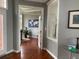 Bright hallway with hardwood floors and a world map at 2569 Dawn Ridge Dr, Carmel, IN 46074
