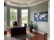 Bright home office features built-in shelving and large windows at 2569 Dawn Ridge Dr, Carmel, IN 46074